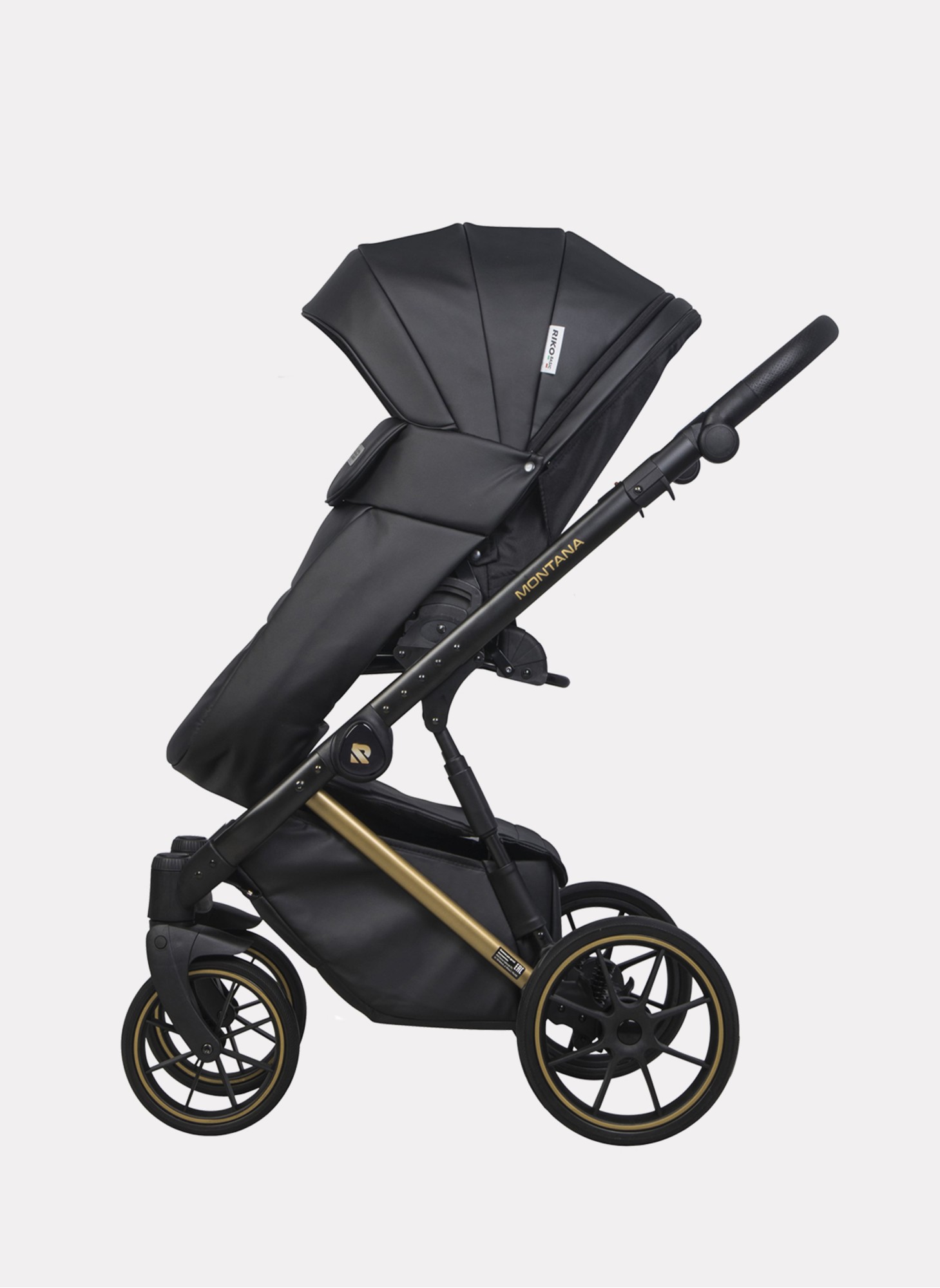 Детская коляска 2 в 1 Riko Basic Montana Premium Gold 02 из экокожи | Реверсивный прогулочный блок | Регулируемая амортизация | Передние поворачиваемые колеса из резины | Цвет - черный