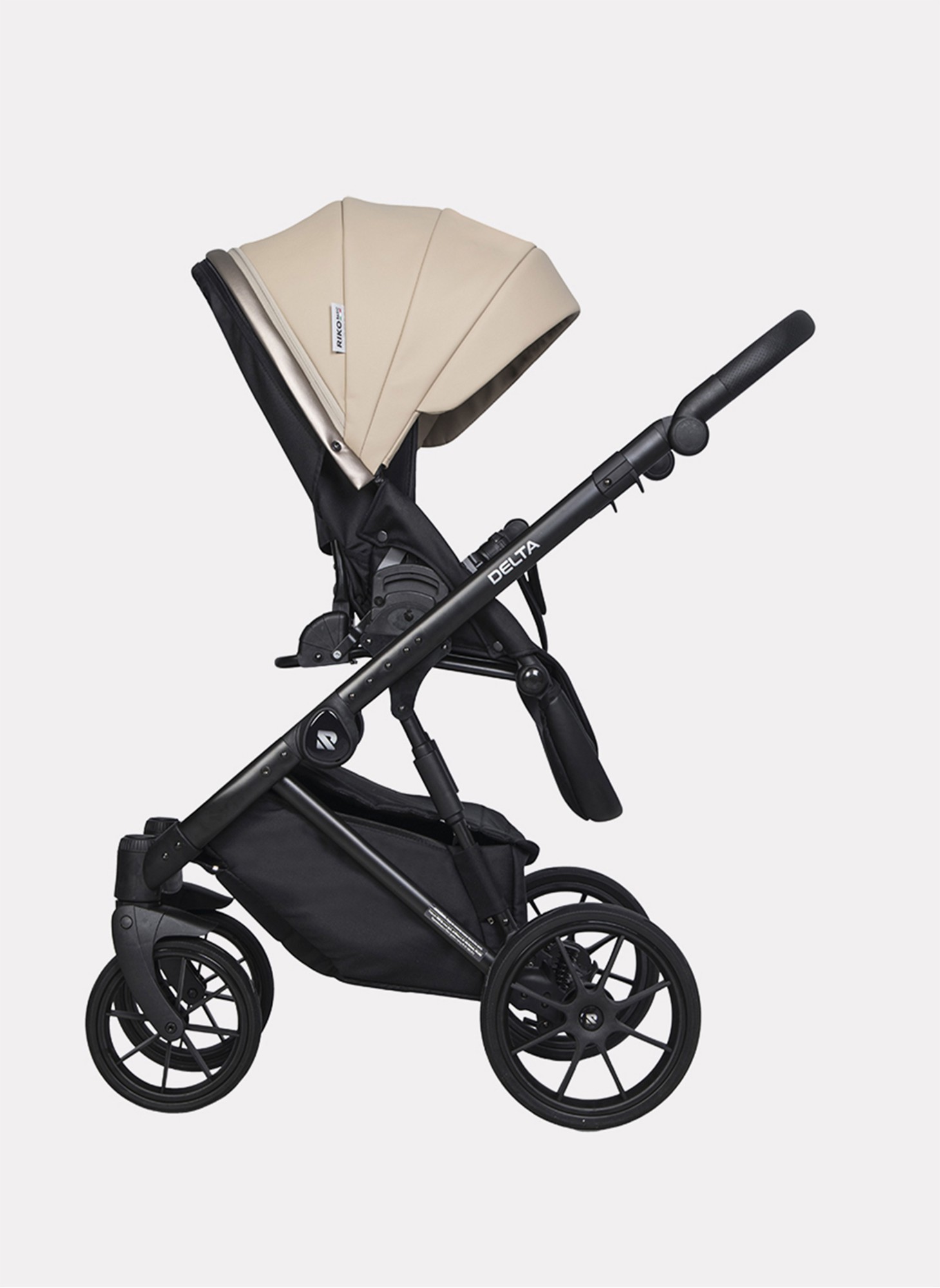 Детская коляска 2 в 1 Riko Basic Delta Ecco из экокожи, с поворотными передними колесами | Реверсивный прогулочный блок | Колеса из вспененной резины | Цвет - бежевый